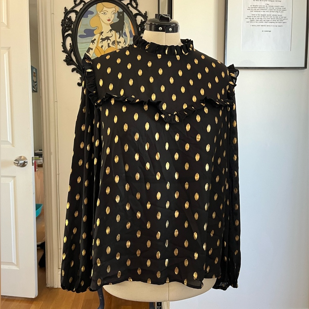 Black and gold ruffled blouse